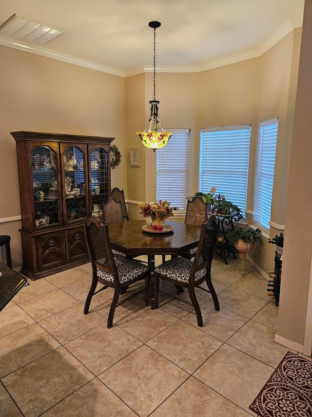 7205 Columbia Ln, Amarillo, TX 79109 - dining space featuring light tile patterned flooring and ornamental molding