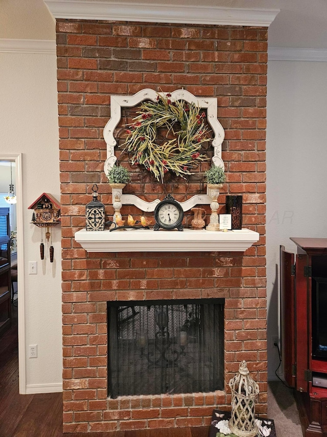 7205 Columbia Ln, Amarillo, TX 79109 - detailed view of a brick fireplace, crown molding, and wood finished floors