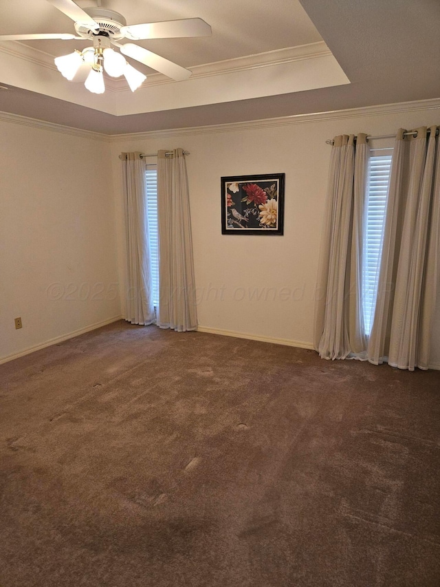 7205 Columbia Ln, Amarillo, TX 79109 - spare room featuring ornamental molding, carpet flooring, a ceiling fan, and a raised ceiling