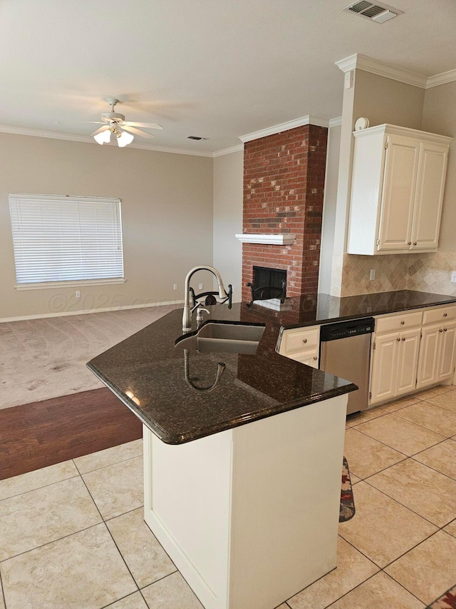 7205 Columbia Ln, Amarillo, TX 79109 - kitchen with dishwasher, ceiling fan, crown molding, light tile patterned floors, and backsplash