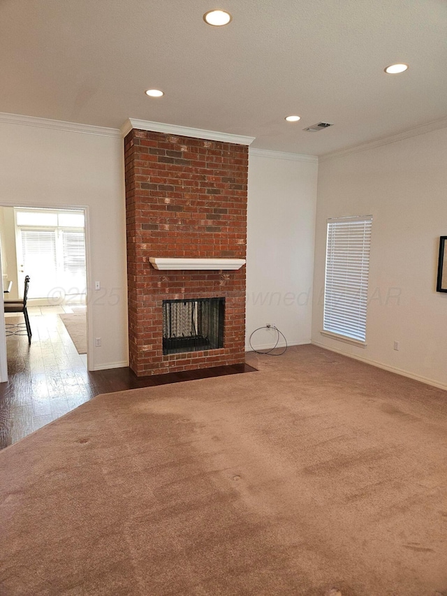 7205 Columbia Ln, Amarillo, TX 79109 - unfurnished living room with ornamental molding, recessed lighting, and a fireplace