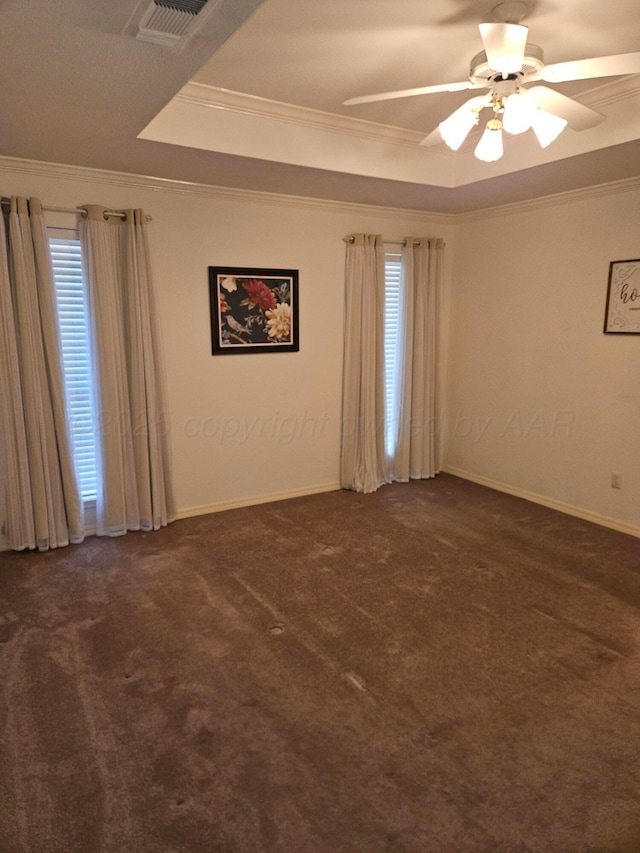 7205 Columbia Ln, Amarillo, TX 79109 - unfurnished room featuring a raised ceiling, crown molding, carpet floors, plenty of natural light, and ceiling fan