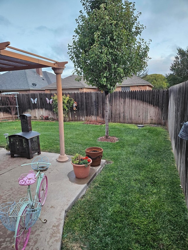 7205 Columbia Ln, Amarillo, TX 79109 - fenced backyard with a patio