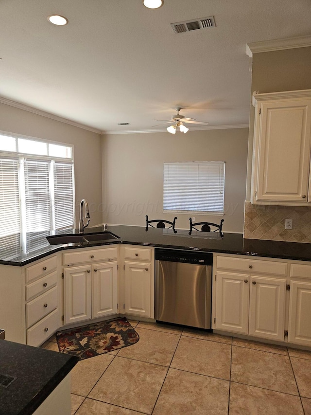 7205 Columbia Ln, Amarillo, TX 79109 - kitchen featuring dishwasher, crown molding, ceiling fan, white cabinets, and light tile patterned flooring