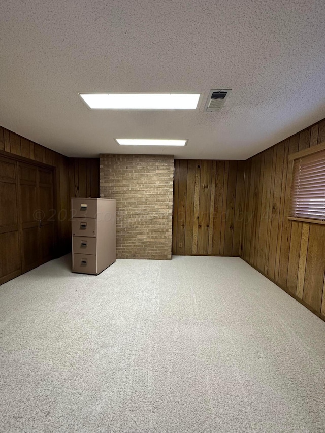 interior space with wood walls and light carpet