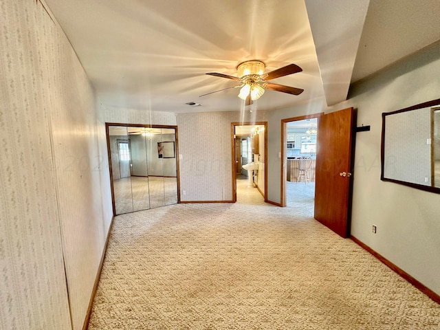 hallway with light colored carpet