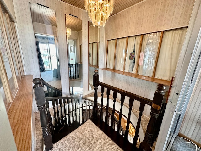 interior space with carpet flooring and an inviting chandelier