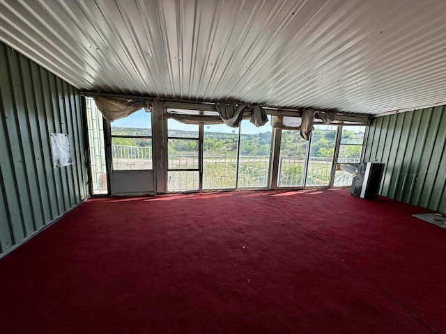 unfurnished sunroom with a wealth of natural light