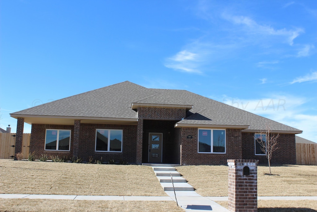 8106 Miami Ave, Amarillo, TX 79118 - view of front of property featuring roof with shingles and brick siding