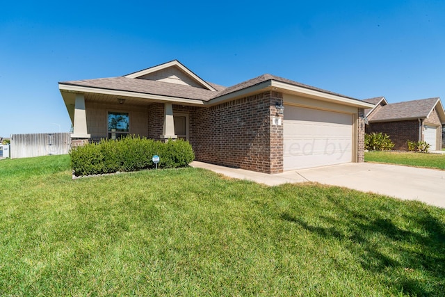 single story home with a garage and a front yard