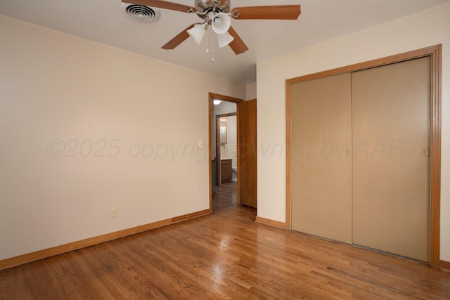 4405 S Ong St, Amarillo, TX 79110 - unfurnished bedroom with wood finished floors, a closet, and a ceiling fan