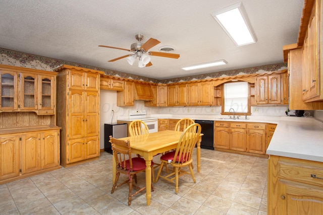 4405 S Ong St, Amarillo, TX 79110 - kitchen with white electric range oven, dishwasher, ceiling fan, light countertops, and glass insert cabinets