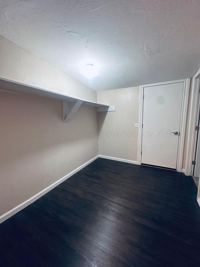704 3rd Pl, Dumas, TX 79029 - walk in closet featuring wood finished floors