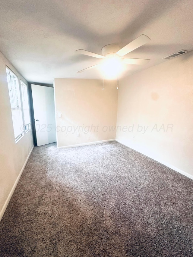704 3rd Pl, Dumas, TX 79029 - carpeted empty room with ceiling fan and a textured ceiling