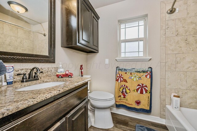 7402 Southbend Dr, Amarillo, TX 79119 - bathroom featuring vanity, wood finished floors, and shower / bath combination