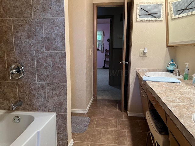 bathroom with tile patterned floors, vanity, and shower / bathing tub combination