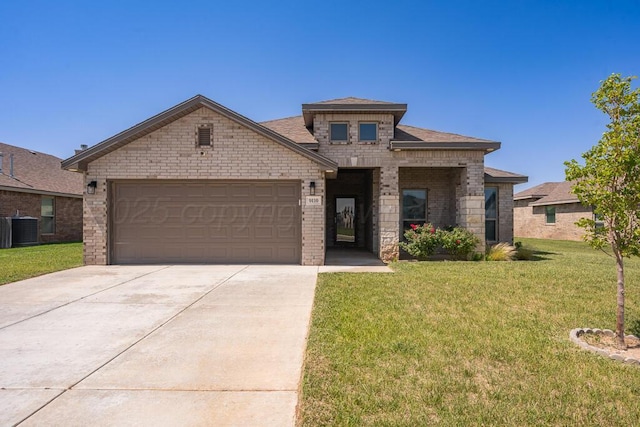 9110 Lexford Dr, Amarillo, TX 79119 - view of front of property with concrete driveway, an attached garage, a front lawn, brick siding, and a shingled roof