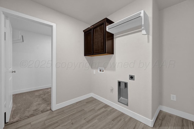 9110 Lexford Dr, Amarillo, TX 79119 - laundry area with electric dryer hookup, washer hookup, light wood-style flooring, cabinet space, and hookup for a gas dryer