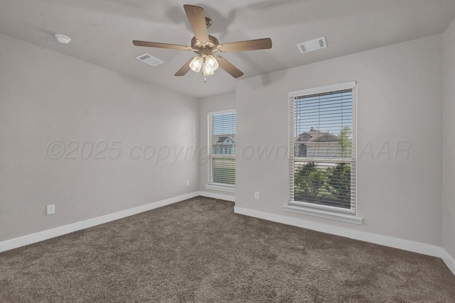 9110 Lexford Dr, Amarillo, TX 79119 - empty room with dark carpet, a ceiling fan, and a smoke detector