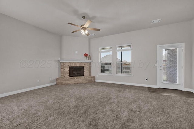 9110 Lexford Dr, Amarillo, TX 79119 - unfurnished living room with carpet, ceiling fan, and a brick fireplace