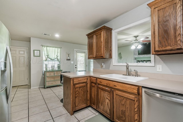 2002 SW 61st Ave, Amarillo, TX 79118 - kitchen featuring stainless steel appliances, a sink, light tile patterned floors, light countertops, and recessed lighting