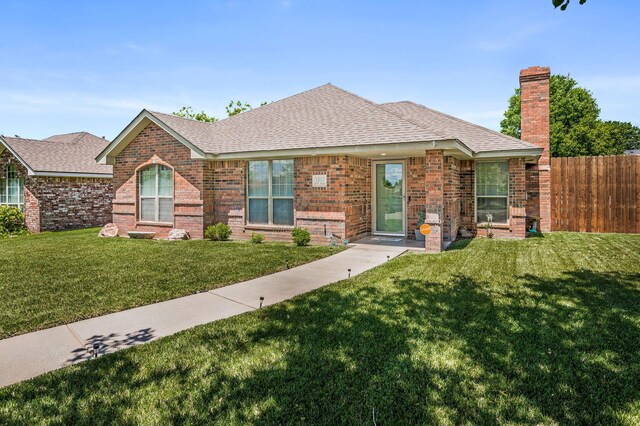 2002 SW 61st Ave, Amarillo, TX 79118 - ranch-style house featuring a shingled roof, brick siding, and a chimney