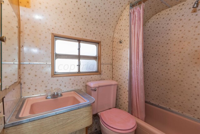 full bathroom with vanity, shower / bath combination with curtain, and toilet