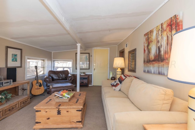 living room featuring lofted ceiling with beams, ornate columns, and carpet floors