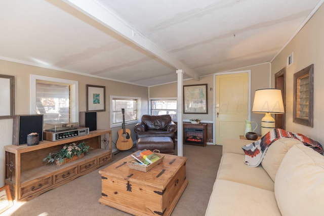 carpeted living room with a fireplace, lofted ceiling with beams, and decorative columns