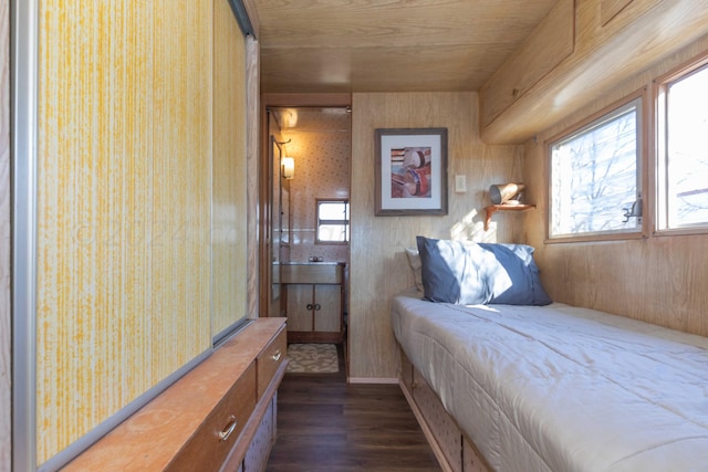 bedroom featuring wood ceiling, wooden walls, and dark hardwood / wood-style flooring