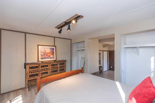 bedroom featuring hardwood / wood-style flooring and a closet