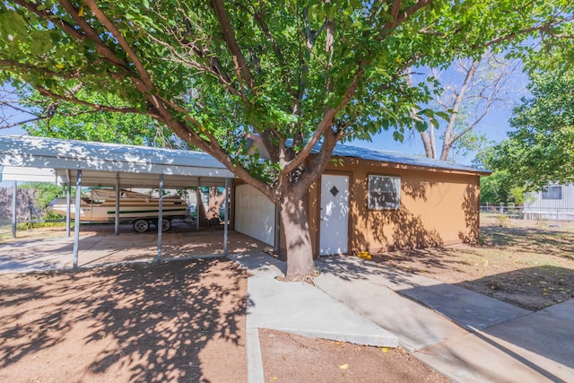 ranch-style house with a carport