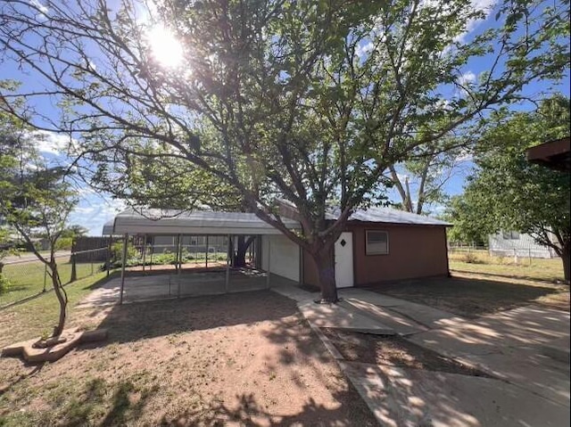 rear view of property with a carport