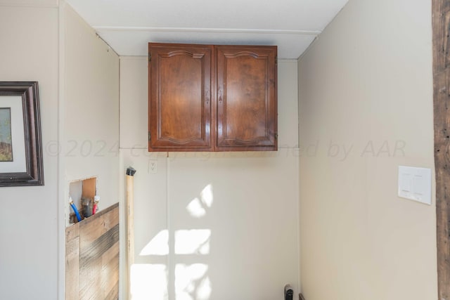 laundry area with cabinets and hookup for a washing machine