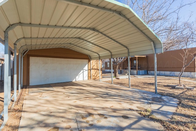 view of parking / parking lot with a garage and a carport