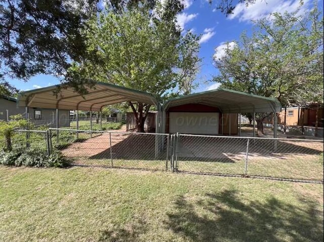 exterior space featuring a garage, a carport, and a yard