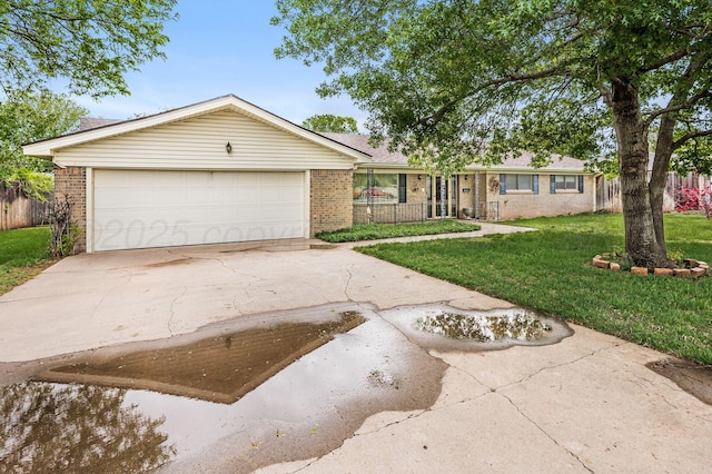 613 Bennett Dr, Dumas, TX 79029 - single story home featuring brick siding, concrete driveway, and an attached garage