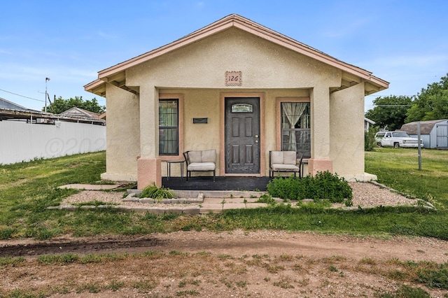126 S Nelson St, Pampa, TX 79065 - bungalow-style home with stucco siding and covered porch