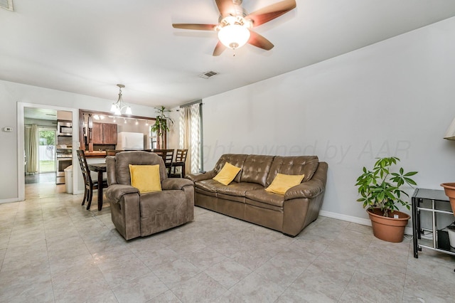 126 S Nelson St, Pampa, TX 79065 - living area featuring a chandelier, a ceiling fan, and baseboards