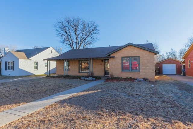 view of front of home with an outbuilding, a garage, and a porch