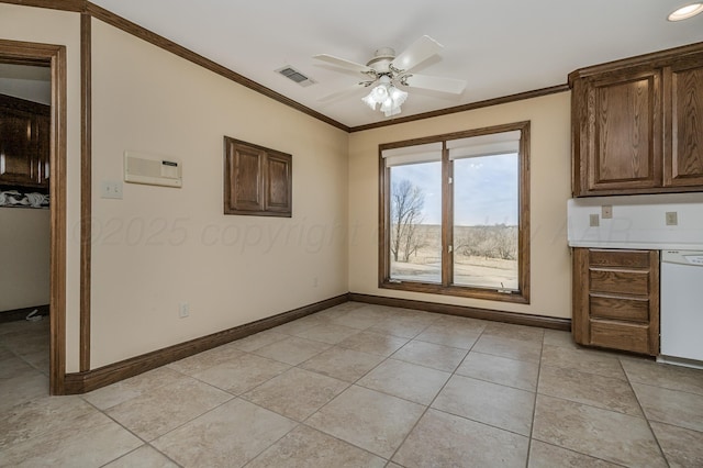 unfurnished dining area featuring ornamental molding, light tile patterned floors, baseboards, and a ceiling fan