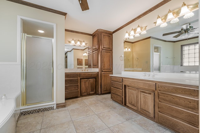 bathroom with a ceiling fan, ornamental molding, a shower stall, and vanity