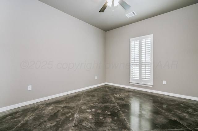 unfurnished room with baseboards, visible vents, ceiling fan, and concrete flooring