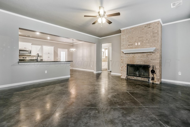 unfurnished living room featuring baseboards, a fireplace, visible vents, and ornamental molding