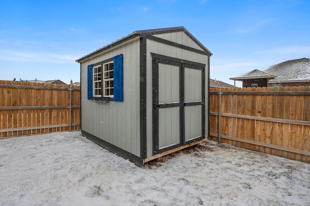 view of shed with a fenced backyard