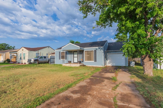 1910 S Seminole St, Amarillo, TX 79103 - ranch-style home with driveway, a front yard, a garage, and roof with shingles