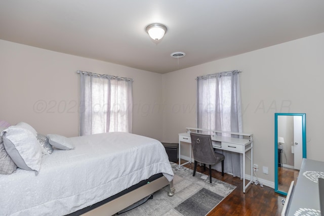 1910 S Seminole St, Amarillo, TX 79103 - bedroom with multiple windows and wood finished floors