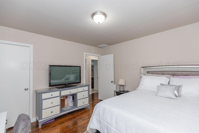 1910 S Seminole St, Amarillo, TX 79103 - bedroom with dark wood-style flooring