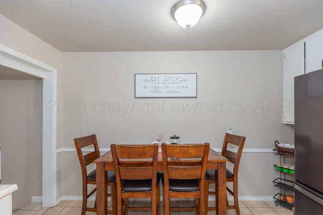 1910 S Seminole St, Amarillo, TX 79103 - dining space featuring light tile patterned floors and baseboards