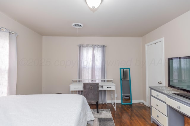 1910 S Seminole St, Amarillo, TX 79103 - bedroom featuring dark wood-style flooring and baseboards